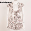 LadySymbol Floral Print White Women Romper Jumpsuit Summer 2017 Bow Tie Backless Sexy Ruffle Beach Short Casual Overall Playsuit LadySymbol Floral Print White Women Romper Jumpsuit Summer 2017 Bow Tie Backless Sexy Ruffle Beach Short Casual Overall Playsuit