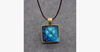 Glowing Pyramid Pendant with Blue Crystal – Add Some Shine and Color To Your Collection Glowing Pyramid Pendant with Blue Crystal – Add Some Shine and Color To Your Collection