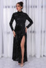 Black sequin gown by Evelyn Belluci