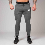 2017 Autumn Winter New Men Casual Joggers Compression Tight Zipper Packet Gyms Bodybuilding Pants Elastic Workout Sweatpants