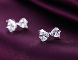 POLISHED FANTASY - SILVER BOW STUD EARRINGS