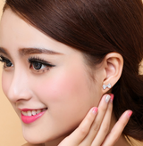 POLISHED FANTASY - SILVER BOW STUD EARRINGS