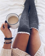 Lace over knee piles of stockings