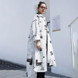 Toriko "Newspaper" print shirt dress