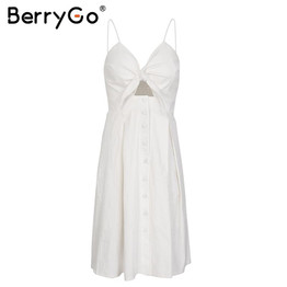 BerryGo Hollow out strap midi dress women Causal backless summer dress female Button bow white dress 2018 spring vestidos