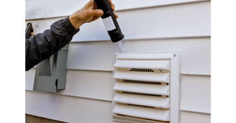 homeguide-dryer-vent-installation-on-a-house-exterior