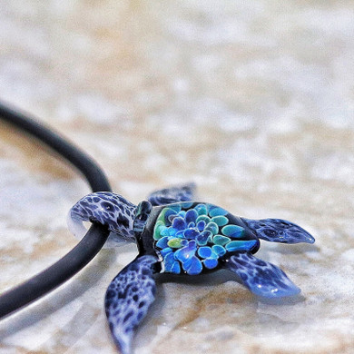 Mystic glass white sea turtle with stunning blues and greens of the ocean.