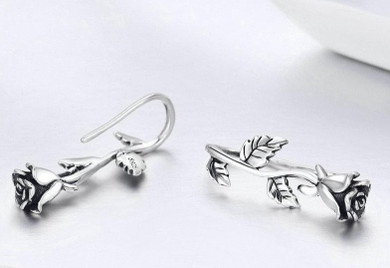 Sterling Silver Rose shaped stud earrings.