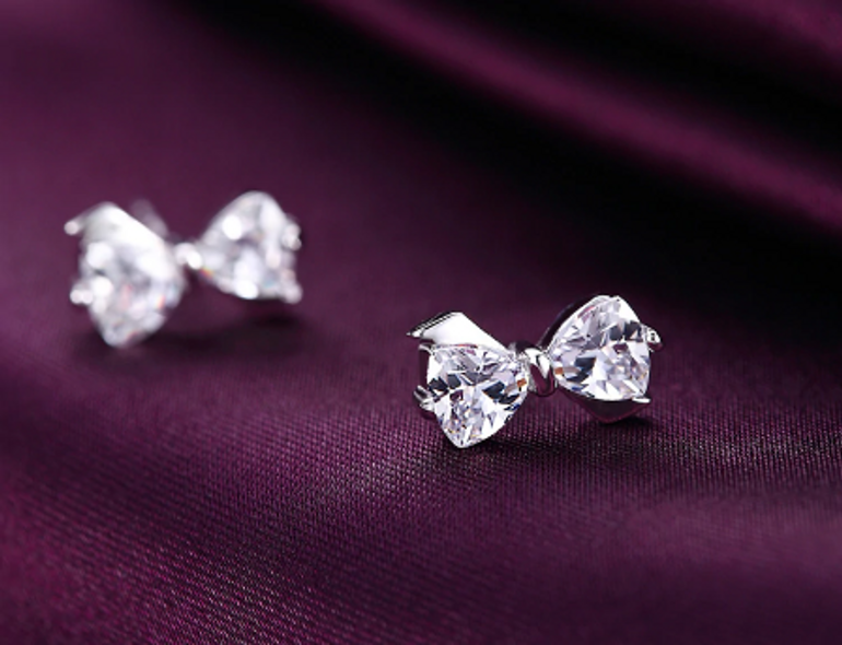 POLISHED FANTASY - SILVER BOW STUD EARRINGS
