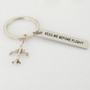 Kiss Me Before Flight 2 Tagged Airplane Key Chain