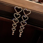 descending heart earrings