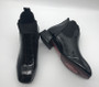 Black patent leather flat ankle boots