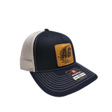 Navy and white 'AG' Patch Richardson 112 Hat with snapback closure, featuring an embroidered 'AG' patch on the front. Structured fit with an adjustable snapback for a secure, comfortable fit.