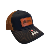 Navy and tan AG Diesel Solutions Patch Richardson 115 Hat with a bold AG Diesel Solutions patch, designed with a structured mid-profile fit and snapback closure