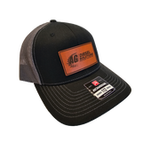 Black and gray AG Diesel Solutions Patch Richardson 115 Hat showcasing an AG Diesel Solutions patch, with a structured fit and snapback closure for comfort and style
