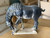 Black terra cotta horse drinking water