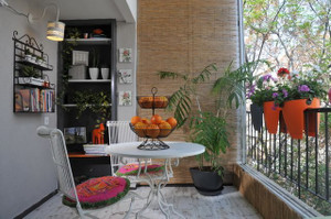 Indoor view of Greenbo orange railing planters.