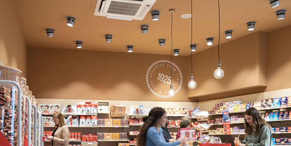 People shop for chocolate inside a Loacker cafe.