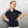 A navy blue kids' polo shirt featuring a logo on the left side, displayed on a girl against a brick wall backdrop.