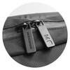 A zip detail of a black Moleskine Metro Slim Backpack featuring dual zippers and a textured surface.