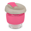 A drink bottle with a transparent glass body, pink silicone sleeve, and a speckled grey lid. It features a logo.
