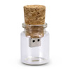 A drink bottle-shaped flash drive with a cork stopper, featuring a silver USB connector, in clear glass.