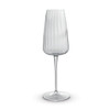 A clear glass flute with a ribbed design and a slender stem, featuring a simple, elegant silhouette.