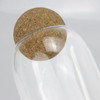 A clear glass canister with a round cork lid, highlighting a sleek and modern design.