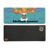 A colorful desk mat featuring a whimsical design with clouds and a central character, in teal and gray colors.