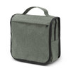 A green toiletry bag with a top handle, featuring a zippered pocket and a textured fabric design.
