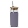 A glass tumbler with a light purple silicone sleeve, a bamboo lid, and a stainless steel straw.