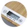 A bamboo kitchen scale featuring a digital display, measuring up to 5000g with a sleek, natural finish.