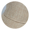 A beige cap with a textured woven design, featuring a curved brim and an integrated logo.