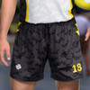 Men's volleyball shorts in black with a dotted pattern, featuring yellow accents and a logo.