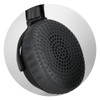 A close-up of a black headphone earcup featuring a textured surface and a circular design pattern.