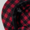 A red and black checked bucket hat with a soft inner lining and a care label inside.
