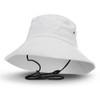 A white bucket hat with a wide brim and an adjustable chin strap, featuring a logo.