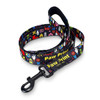 A dog leash featuring a vibrant pattern of cartoonish designs, primarily in black with colourful prints and a clip attachment.