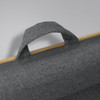 A grey fabric handle attached to a bamboo lap desk, highlighting the texture and natural material.