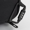 A black anti-theft backpack briefcase featuring a combination lock and sturdy attachment clip.