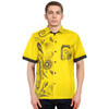 A bright yellow button-up shirt featuring a black patterned design on one side and a matching pocket.