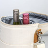 A drink bottle cooler bag in natural colour, holding two wine bottles with metallic caps inside.