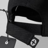 A black Swiss Peak 6 panel cap featuring an adjustable strap and a logo on the back.