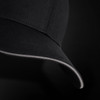 A black six-panel cap featuring a contrasting trim along the brim and a logo.