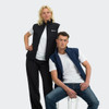 A black men's vest and a navy men's vest are displayed on models against a grey background. Each vest has a logo.