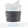 A reusable coffee cup with a clear body, snap lid, and a gray RPET band for grip.