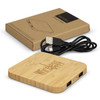 A bamboo wireless charging hub with two USB ports, accompanied by a brown cardboard packaging and a USB cable.