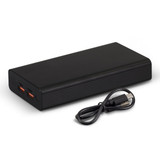 A black power bank with two output ports and a USB charging cable beside it.