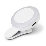 A white Halo Selfie Light with a clip-on feature and a circular design, including a USB charging port.