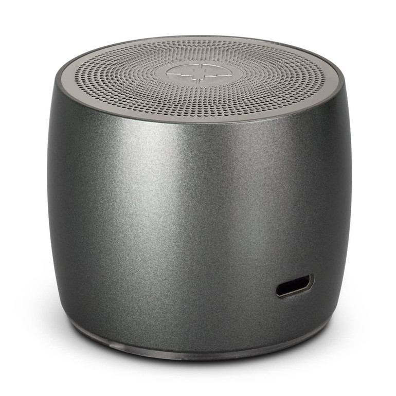 A round, grey speaker with a textured top and a logo, featuring a charging port on the side.